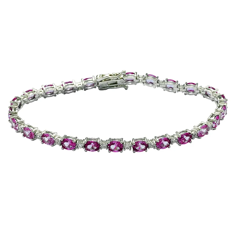 elegant gold bangles for women -Suzy Levian Sterling Silver Oval-Cut Pink Sapphire Tennis Bracelet